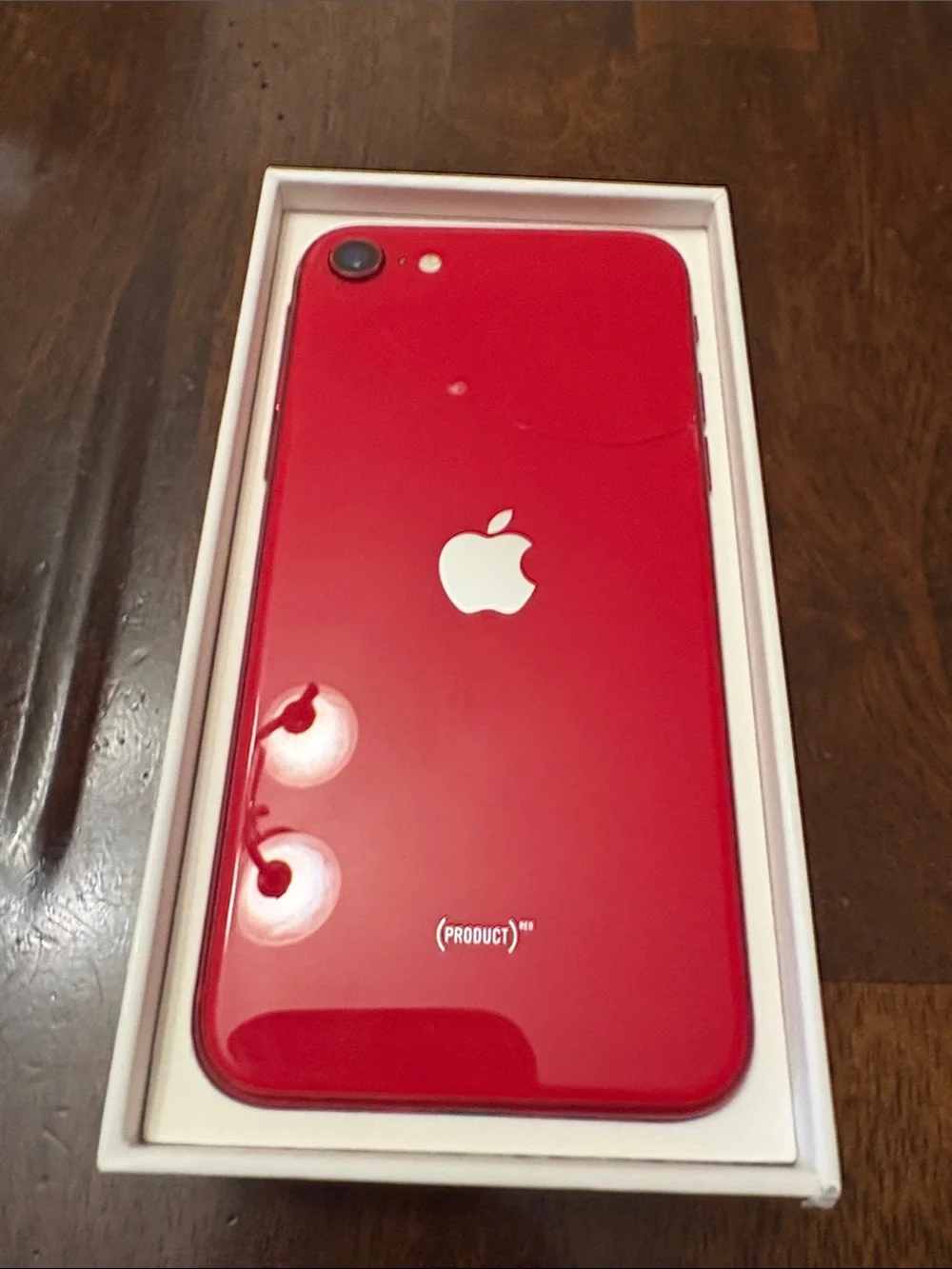Apple iPhone SE in Red - Compact Touch ID Smartphone, Tiny crack in back.